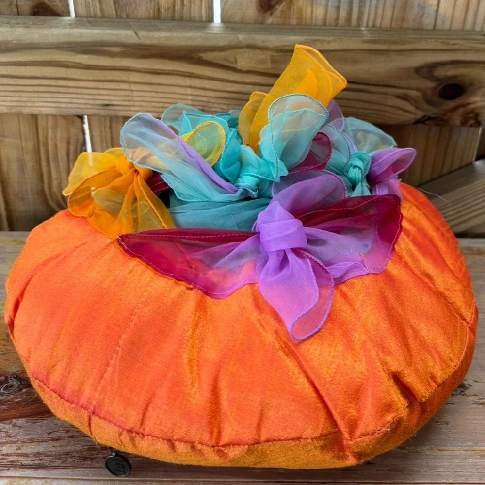 Pier 1 Round Orange Accent Pillow with Chiffon Scarves Tied on Top 14”